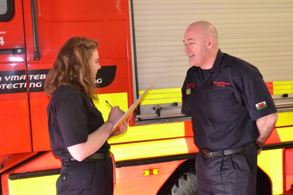 Apprentice interviewing a firefighter